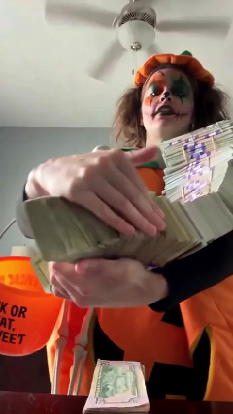 Money Flex meme: a deadpan person hiding behind a fan of prop cash